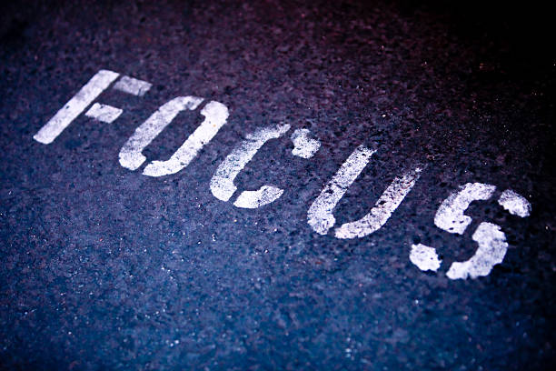 The word focus spray painted onto the black ground stock photo