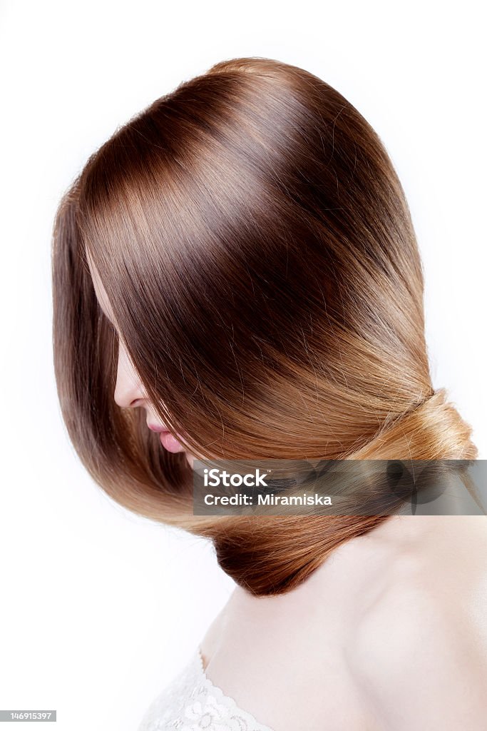 Young woman with long beautiful hair wrapped around the neck Image of beautiful girl broke her nail Adult Stock Photo