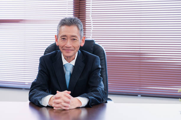 istock A smiling company executive in the boardroom 1469156429