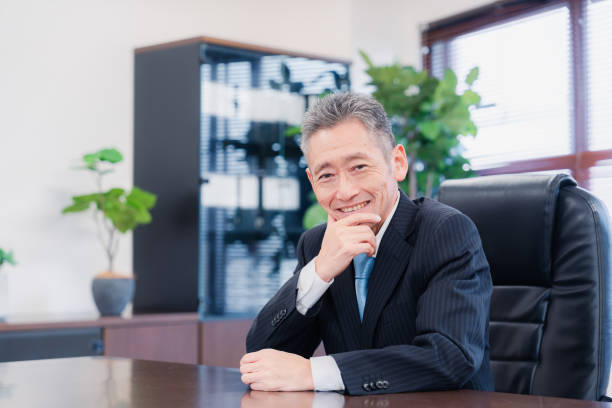 istock A smiling company executive in the boardroom 1469156451