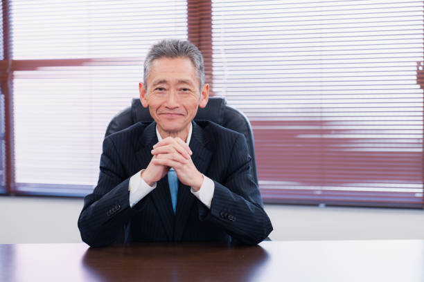istock A smiling company executive in the boardroom 1469156488