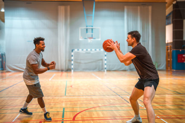 istock Diverse Friends Playing One On One Basketball 1469157359