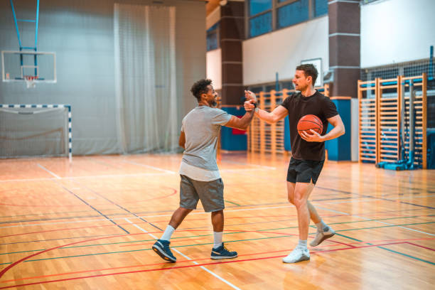 istock Diverse Basketball Players Shaking Hands In A GYM 1469157638