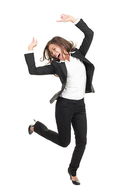 ecstatic businesswoman in suit dancing Ecstatic businesswoman in suit dancing. Excited happy asian business xwoman in full length on white background. Click for more: arms raised women business full length stock pictures, royalty-free photos & images