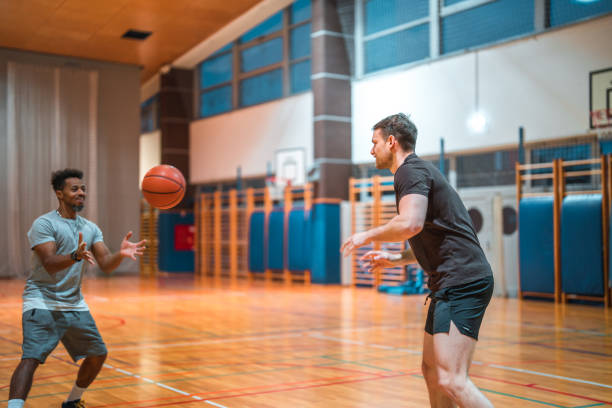 istock Diverse Friends Playing One On One Basketball 1469157876