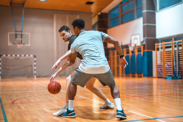 istock Diverse Friends Playing One On One Basketball 1469157905