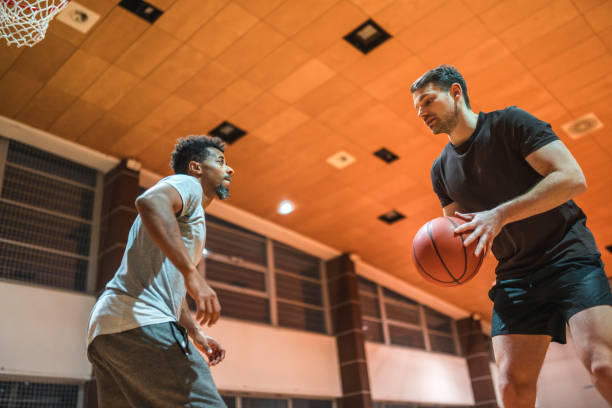 istock Diverse Friends Playing One On One Basketball 1469157909