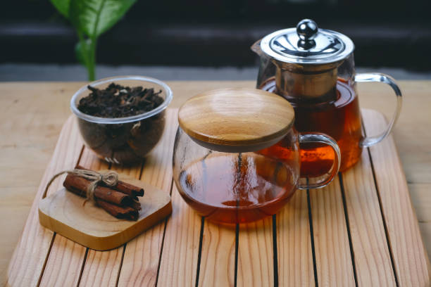 istock Hot herbal tea drink in glass composition with cinnamon 1469159960