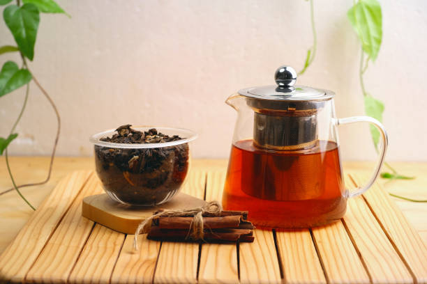 istock Hot herbal tea drink in glass composition with cinnamon 1469160005