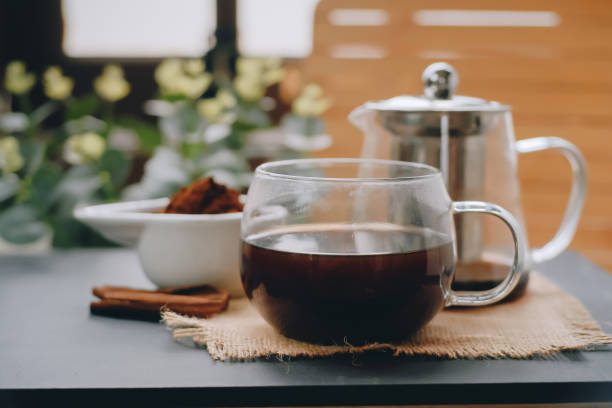 istock Hot herbal tea drink in a teapot in old composition on the table 1469161117