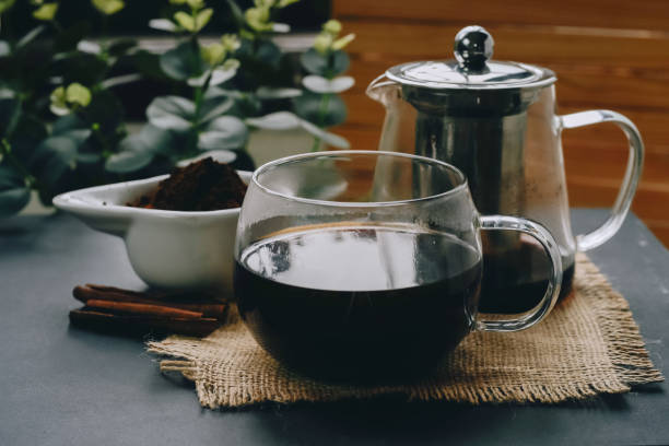 istock Hot herbal tea drink in a teapot in old composition on the table 1469161123