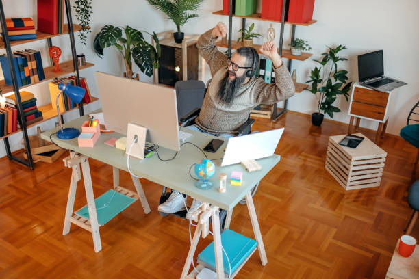 istock Man in wheelchair working from home having a web meeting 1469163193