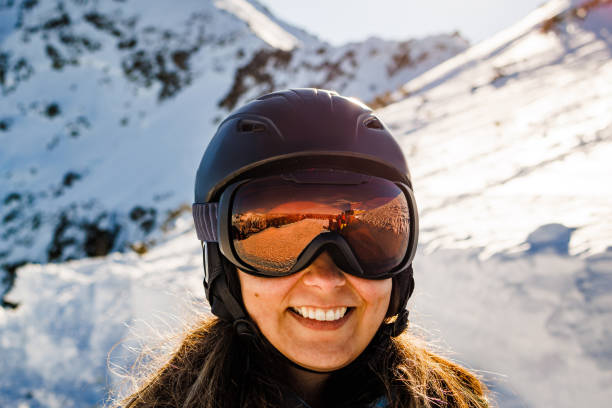 istock Smiling woman enjoys skiing 1469163520