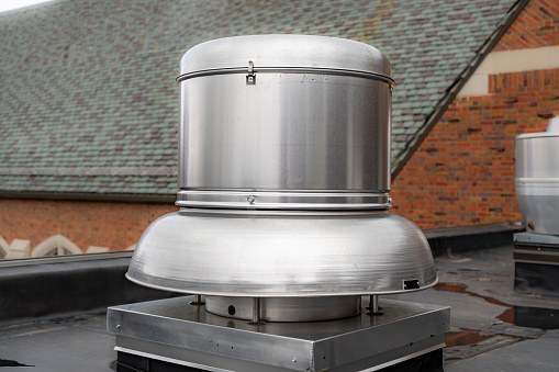 Example of a rooftop exhaust ventilation fan on a new EPDM on a large commercial building