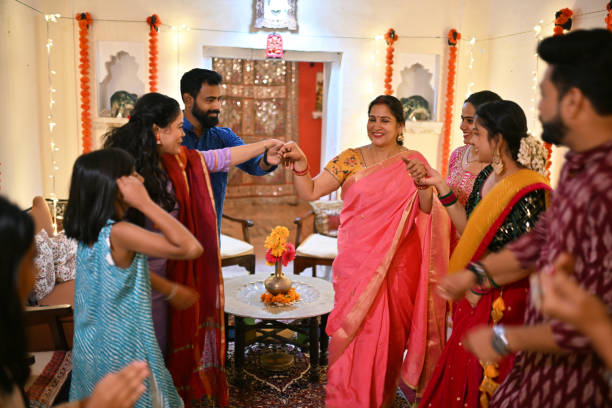 istock Indian Mulit-generation family dancing together during a family function 1469170630