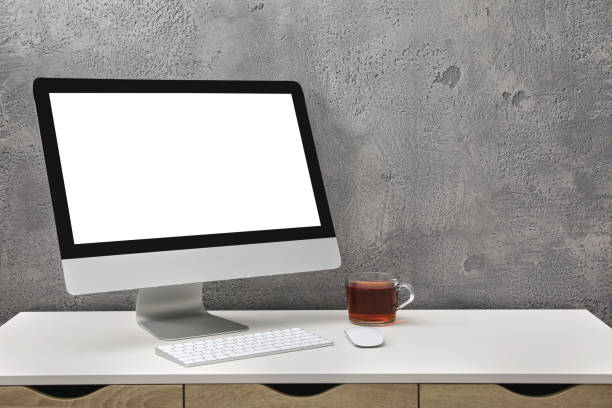 istock Workplace with modern computer monitor, keyboard and mouse on table. Mockup for design 1469171517