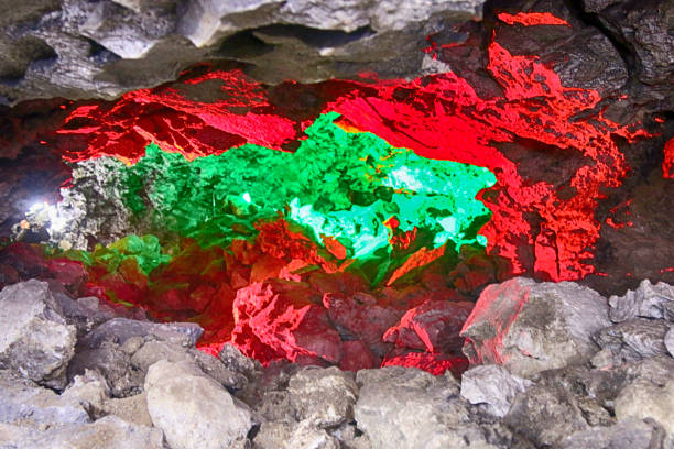 istock Karst cave in variety of colored light 1469176728