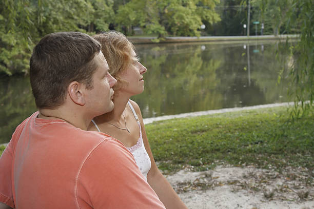 young family in a park stock photo