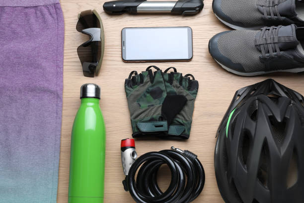 istock Flat lay composition with different cycling accessories on wooden background 1469177225