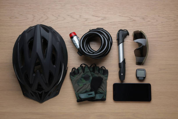 istock Flat lay composition with different cycling accessories on wooden background 1469177274