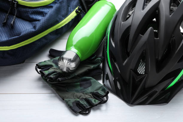 istock Different cycling accessories on white wooden table, closeup 1469178127