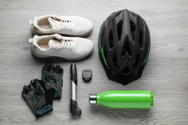istock Flat lay composition with different cycling accessories on wooden background 1469178335