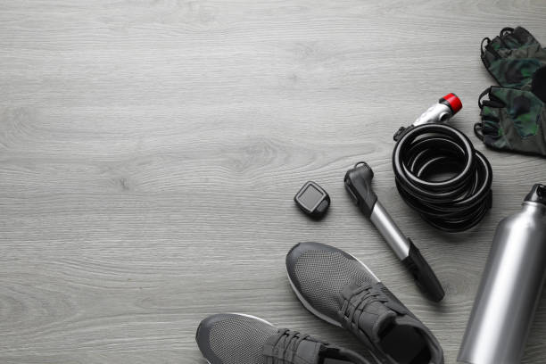 istock Flat lay composition with different cycling accessories on wooden background, space for text 1469178354