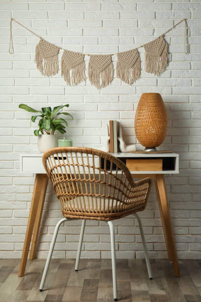 istock Cozy room interior with desk and stylish macrame on wall 1469179543