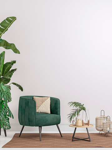 Cozy retro-chic interior with a green velvet armchair and a low white and hardwood cabinet in front of a white plaster wall background with copy space. A low coffee table with ceramic containers, vases on the white hardwood floor, birdcage lamps, and decoration (lush foliage: monstera, banana/palm tree, pillow) with 2 hardwood slat doors on each side. The 50s- 60s decoration, art deco style. A slight vintage effect was added. 3D rendered image.
