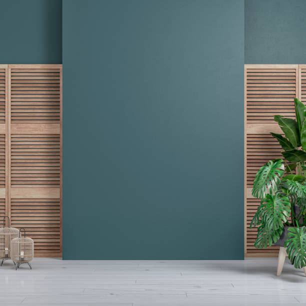Cozy retro-chic interior with a large blank wall background, slat doors and potted plants, the 50s- 60s decoration stock photo