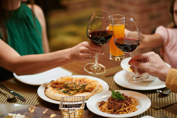 istock Family Toasting Over Table 1469182234