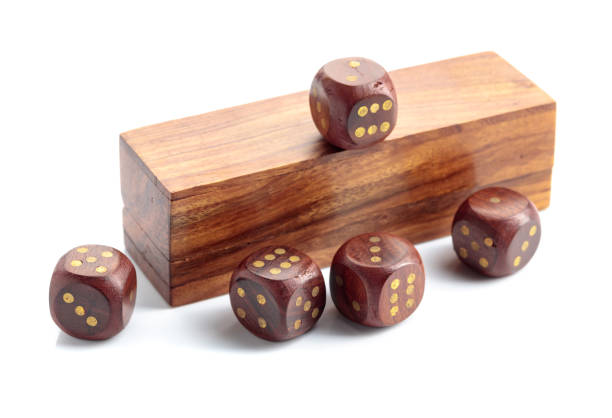 istock The old wooden dice isolated on a white background. 1469182373