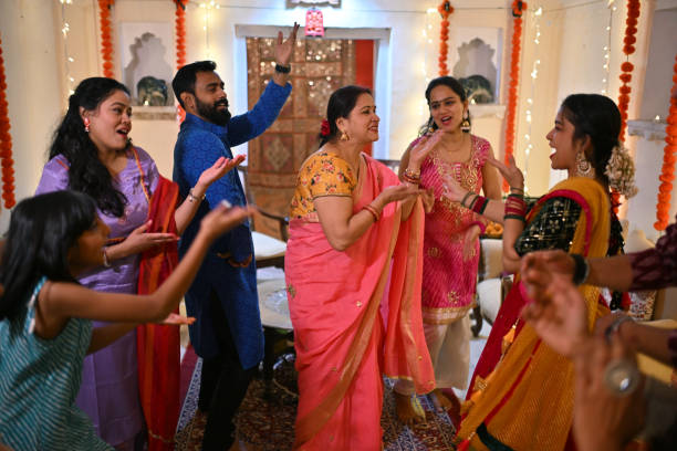 istock Indian Mulit-generation family and friends dancing together during a family function 1469183249