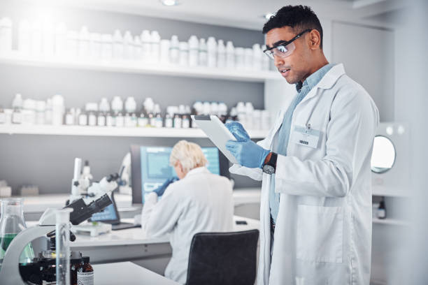 istock Scientist, tablet and research innovation in laboratory for medical analytics, science development or biotech neuroscience. Pharmaceutical data, doctor and pharmacy engineer working in clinic lab 1469185507
