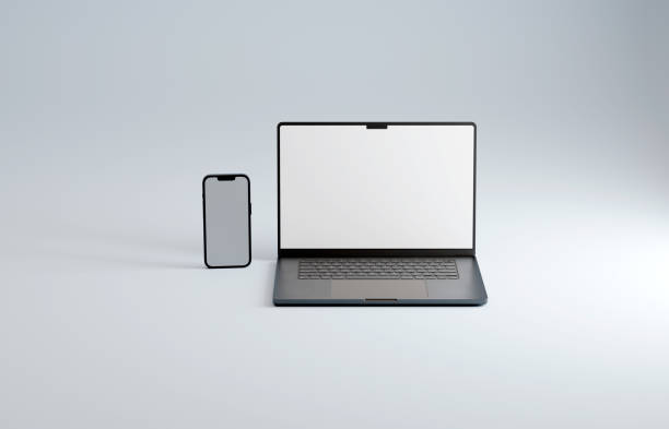 istock Mockup space gray premium brand smartphone and laptop, blank screen. Blue backdrop 1469188596