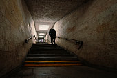 silhouette of the man in underground tunnel