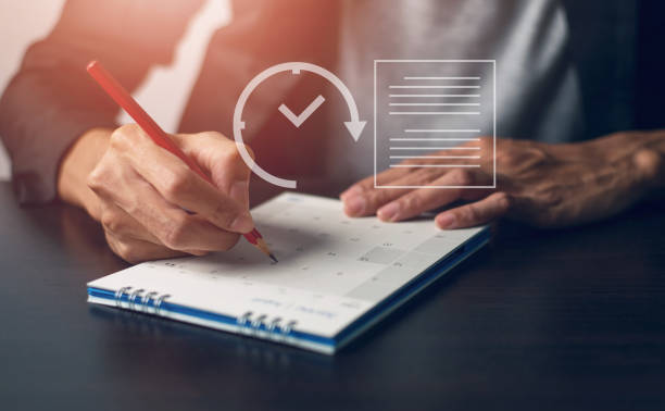 istock Male office worker looking at calendar appointments 1469189876