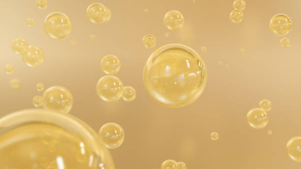 istock Liquid or serum with golden yellow bubbles 1469190046