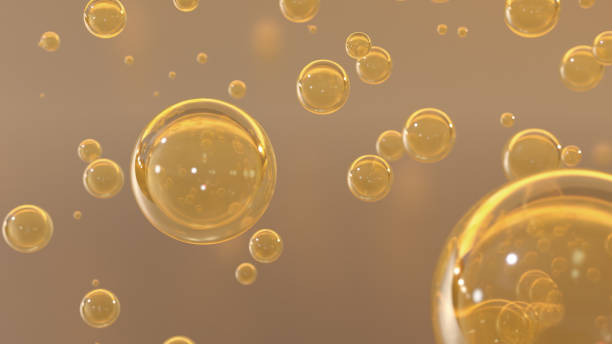 istock 3D cosmetic rendering Bubbles of Golden Serum against a blurred background 1469190065