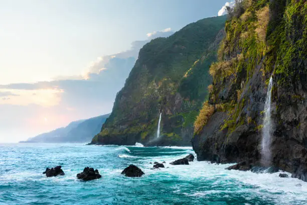 Photo of Beautiful view of Cascata do Veu da Noiva waterfall or Bridal Veil near Porto Moniz and Seixal. Madeira Island, Portugal