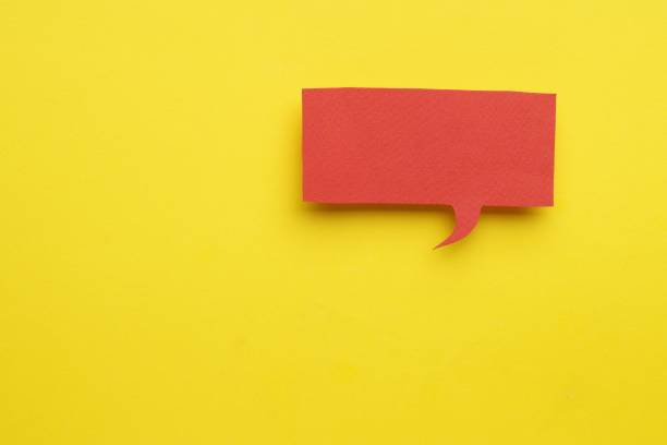 istock Paper speech bubble on yellow background, top view. Space for text 1469191215