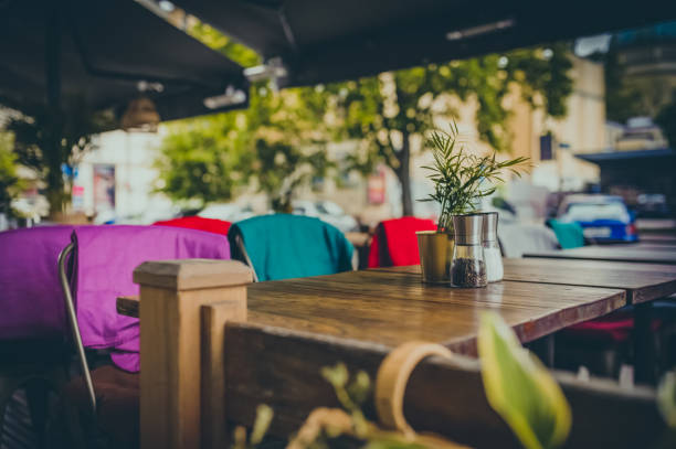 istock Wooden table and comfortable chairs in outdoor cafe 1469191301