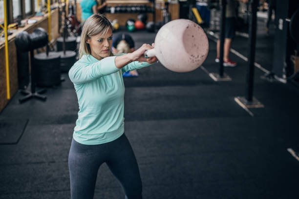 istock Woman exercising with kettlebell 1469193286