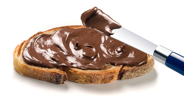 istock Rich, chocolate cream spread generously on a piece of bread 146919333