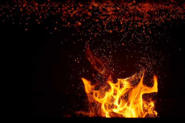 istock Fire flames and sparks on black background 1469194903