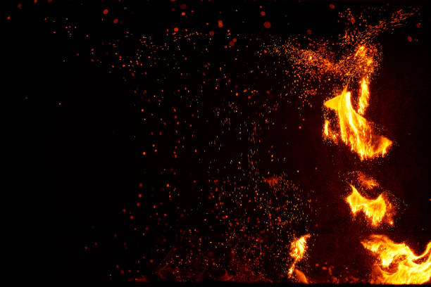 istock Fire flames and sparks on black background 1469195370