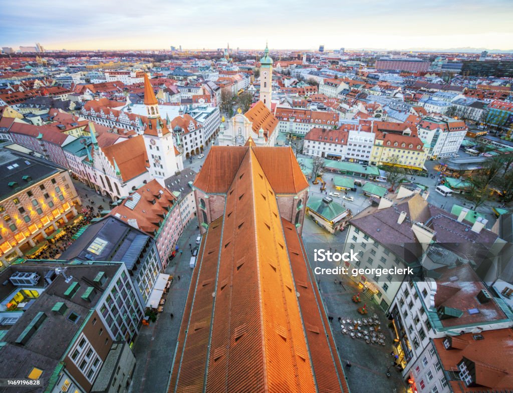 View over historic Munich, Bavaria A view over Peterskirche's rooftop and the Munich cityscape stretching to the horizon. Munich Stock Photo