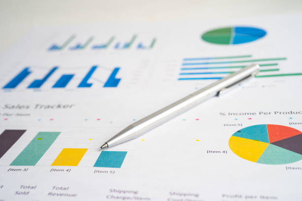 istock Pen on chart or graph paper. Financial, account, statistics and business data concept. 1469200159