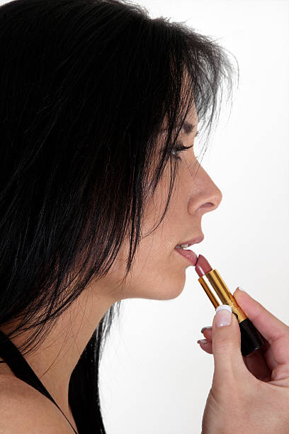 istock Woman applying lipstick 146920199