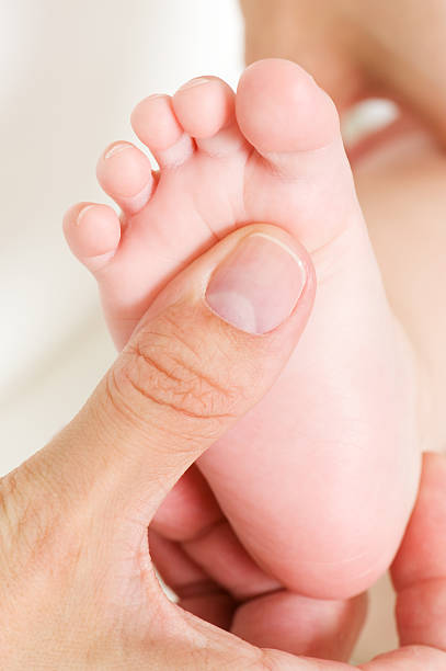 istock making massage of child's foot 146920233
